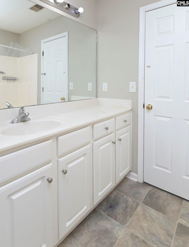 bathroom featuring visible vents and vanity