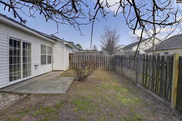 view of yard featuring a patio area and a fenced backyard