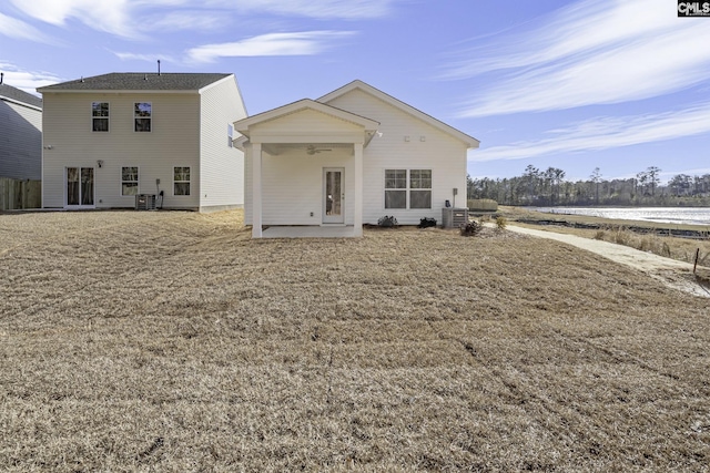 rear view of house featuring a patio area, a lawn, and a ceiling fan