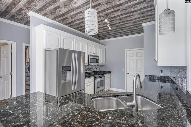 kitchen featuring crown molding, stainless steel appliances, tasteful backsplash, white cabinetry, and a sink