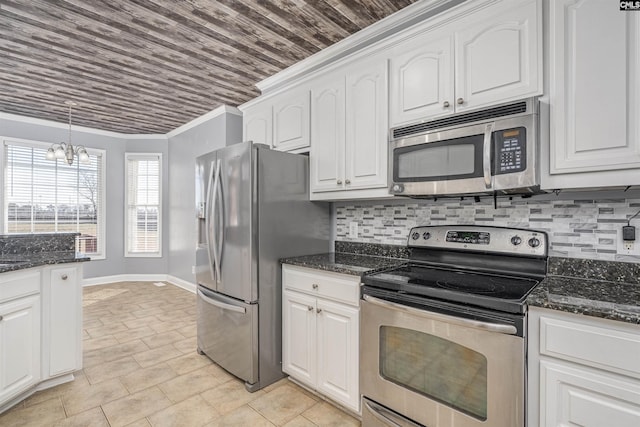 kitchen featuring stainless steel appliances, white cabinets, ornamental molding, and tasteful backsplash