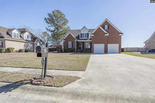 view of front of house with a garage, driveway, a front lawn, and brick siding