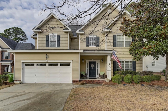 view of front of property with driveway and a garage