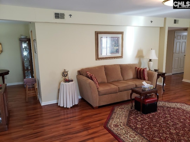 910 Poinsett Pl Unit 5, West Columbia, SC 29169 - living room with visible vents, baseboards, and wood finished floors