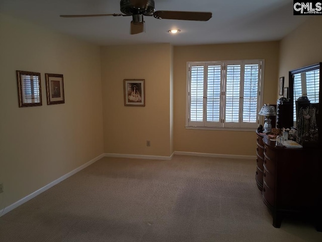 910 Poinsett Pl Unit 5, West Columbia, SC 29169 - bedroom with a ceiling fan, light colored carpet, and baseboards