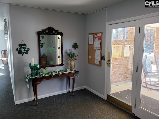 910 Poinsett Pl Unit 5, West Columbia, SC 29169 - doorway featuring dark colored carpet and baseboards