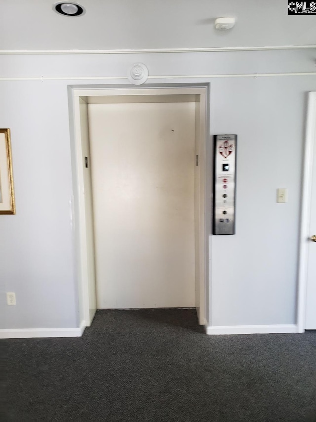 910 Poinsett Pl Unit 5, West Columbia, SC 29169 - corridor featuring elevator and dark carpet