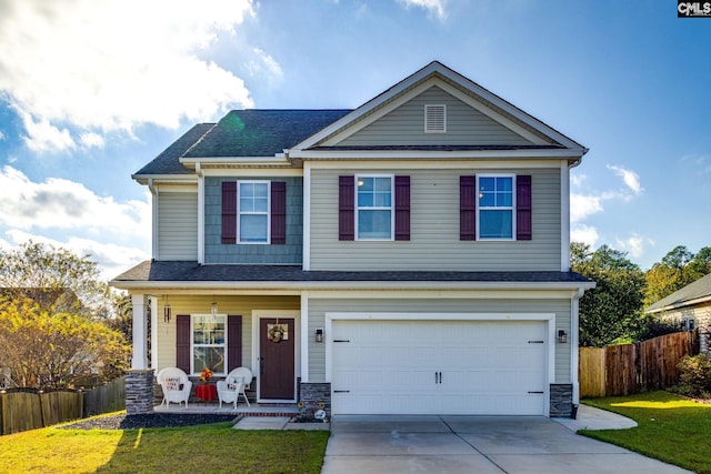 view of front of home featuring covered porch, concrete driveway, a front yard, fence, and a garage