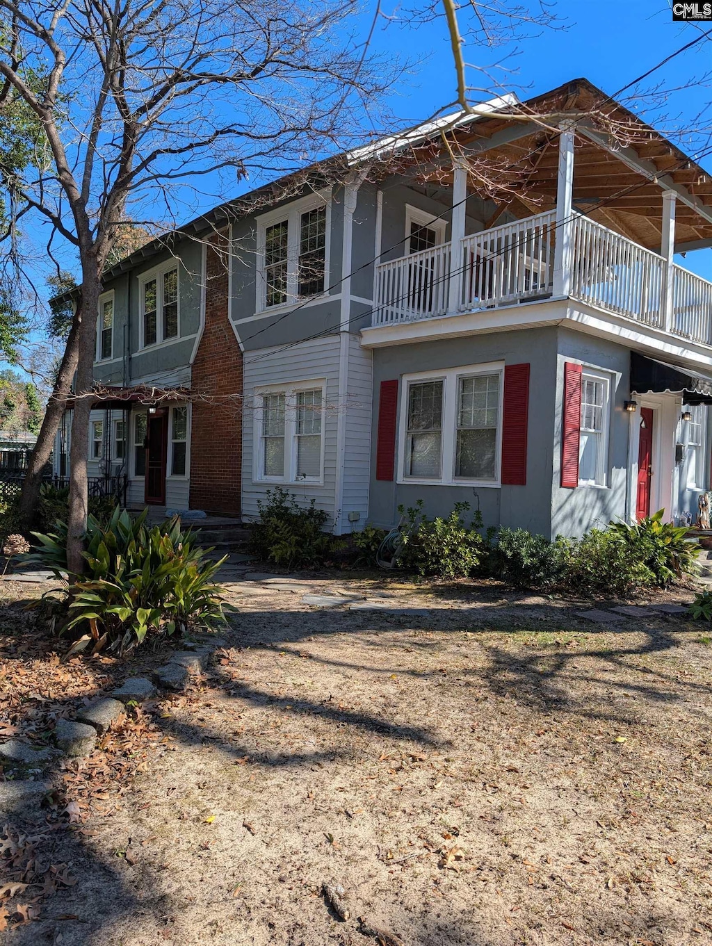 view of home's exterior with a balcony