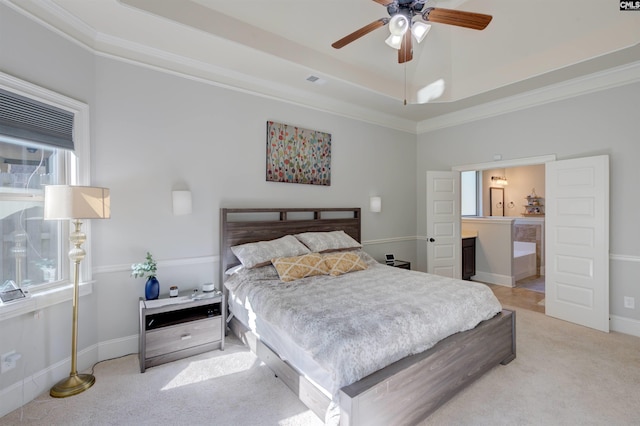 bedroom featuring carpet floors, multiple windows, baseboards, and a raised ceiling