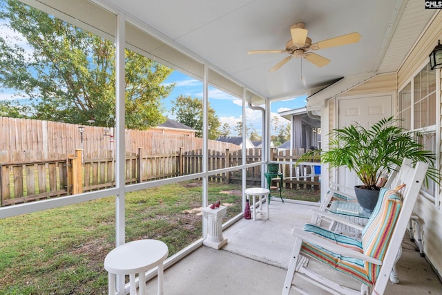 sunroom featuring ceiling fan