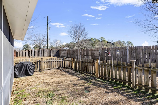 view of yard with a fenced backyard