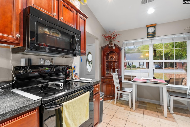 kitchen with lofted ceiling, dark countertops, visible vents, light tile patterned flooring, and black appliances