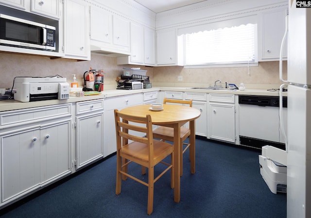 kitchen featuring a sink, white appliances, white cabinets, and light countertops