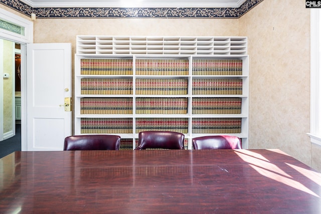 unfurnished dining area with crown molding