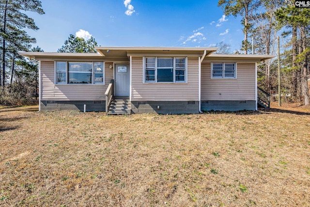 view of front of home with entry steps, crawl space, and a front yard