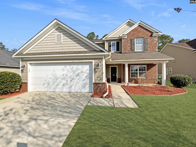 view of front of home with a front yard, concrete driveway, brick siding, and an attached garage