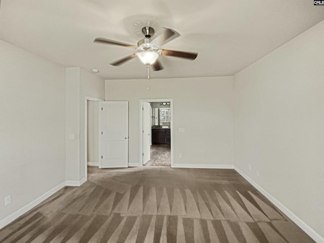 unfurnished room featuring ceiling fan, baseboards, and carpet flooring