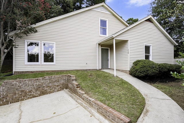 traditional-style home with a front yard