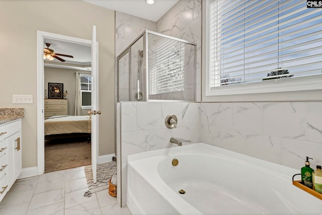 bathroom with marble finish floor, ensuite bathroom, a stall shower, vanity, and a bath