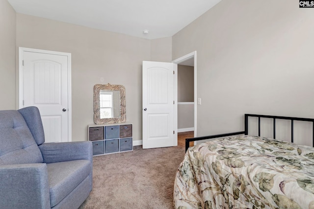 carpeted bedroom featuring baseboards