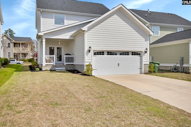 view of front facade with driveway, an attached garage, a porch, and a front yard