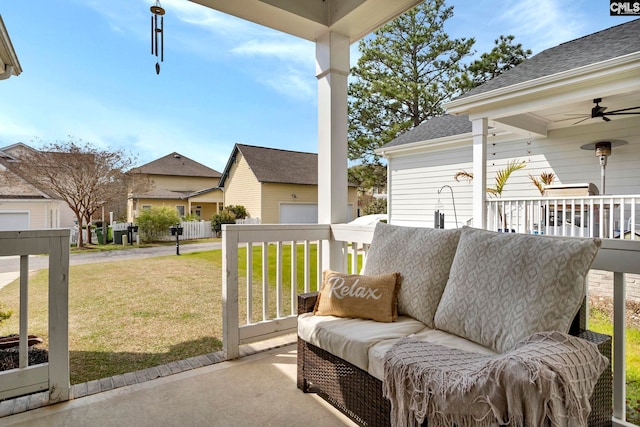 view of patio / terrace with ceiling fan and a residential view