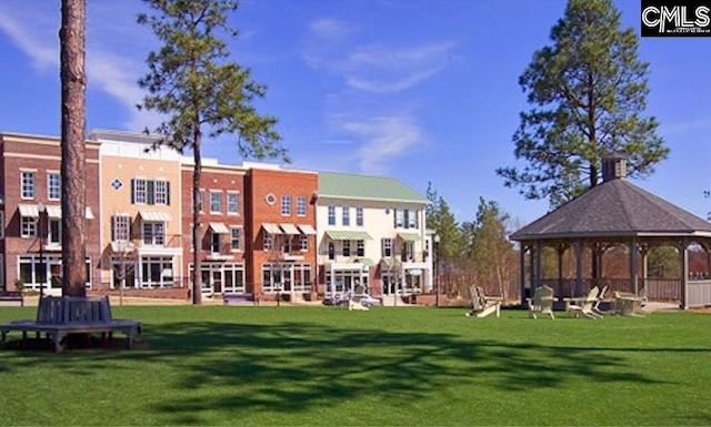 view of community with a gazebo and a lawn