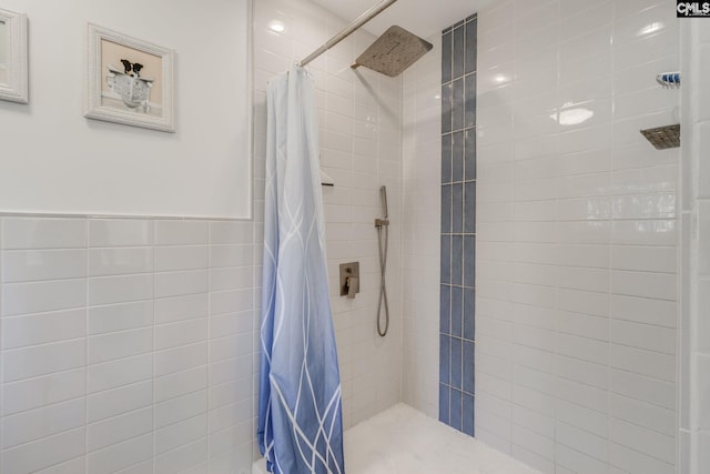 bathroom with tiled shower