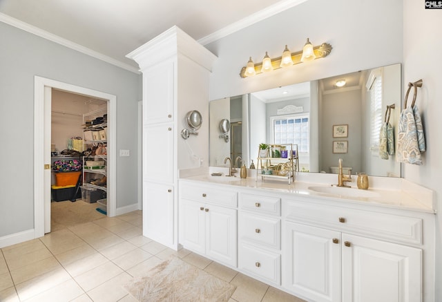 bathroom featuring crown molding and a sink