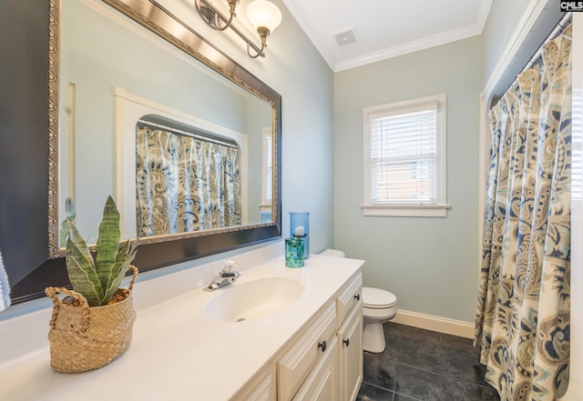 bathroom with toilet, vanity, baseboards, visible vents, and crown molding