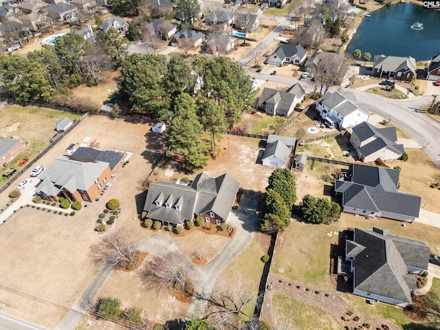 bird's eye view with a residential view and a water view