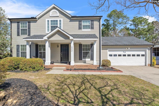 view of front facade featuring a front lawn, driveway, an attached garage, and a porch