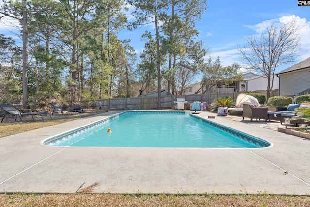 view of pool with a fenced in pool, a patio area, and a fenced backyard