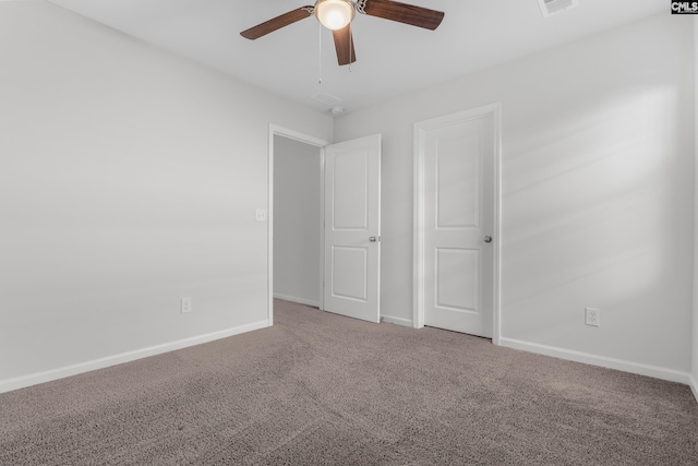 unfurnished bedroom featuring carpet floors, ceiling fan, and baseboards