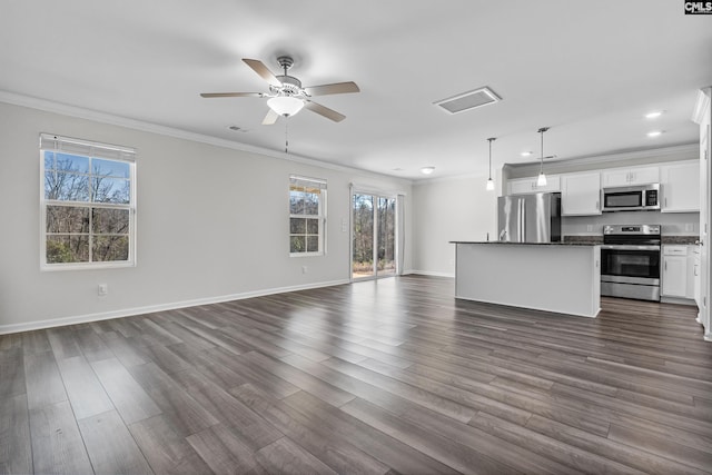 unfurnished living room with dark wood-type flooring, visible vents, baseboards, a ceiling fan, and crown molding