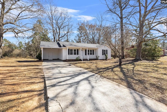 single story home with a porch and concrete driveway