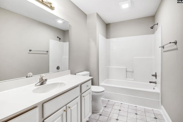 bathroom featuring toilet, baseboards, tub / shower combination, and vanity