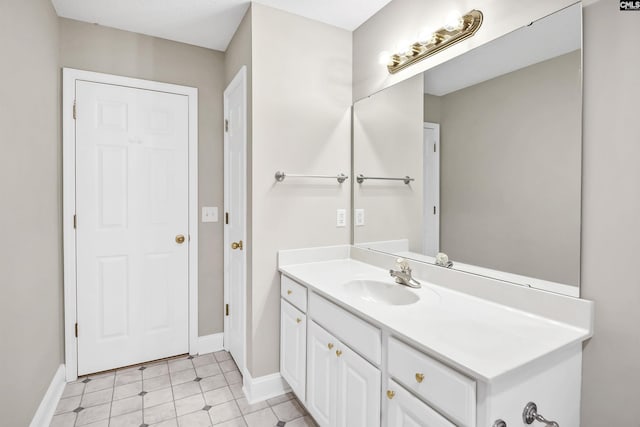 bathroom featuring baseboards and vanity