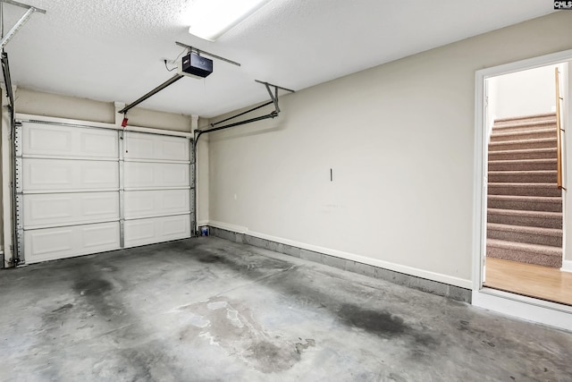 garage featuring baseboards and a garage door opener