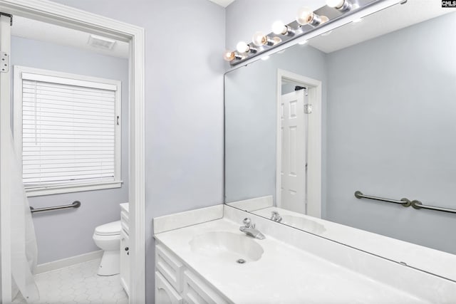 bathroom featuring tile patterned flooring, toilet, visible vents, vanity, and baseboards