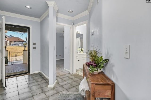 foyer featuring light tile patterned floors, ornamental molding, recessed lighting, and baseboards