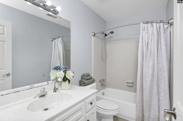 bathroom featuring shower / bath combo, a textured ceiling, vanity, and tile patterned floors