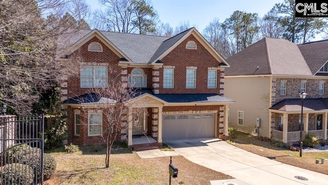 view of front of house featuring an attached garage, brick siding, a shingled roof, fence, and driveway