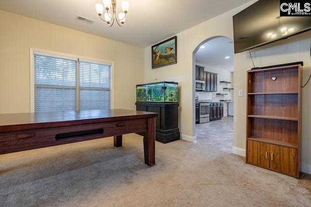 rec room featuring arched walkways, light colored carpet, visible vents, baseboards, and an inviting chandelier