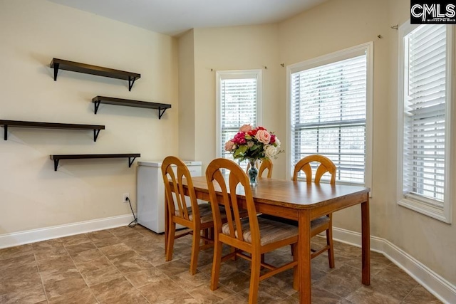 dining room with baseboards