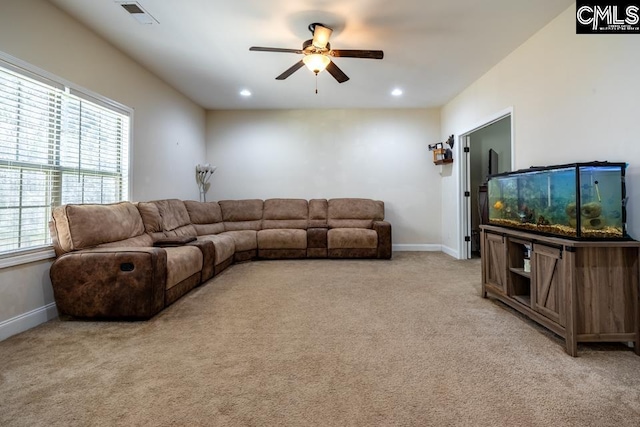 living area featuring recessed lighting, light carpet, visible vents, baseboards, and a ceiling fan