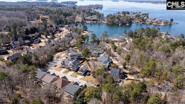 drone / aerial view with a water view and a residential view