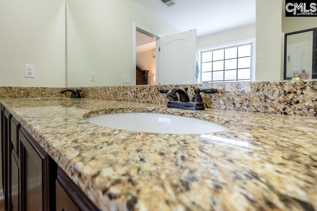 bathroom with visible vents and vanity