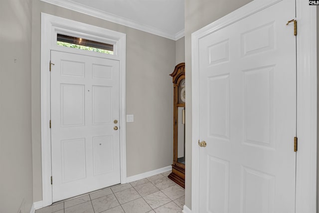 entryway with ornamental molding and baseboards